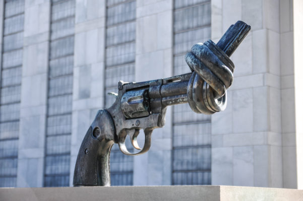 A statue of a handgun with its barrel tied into a knot so that I cannot fire