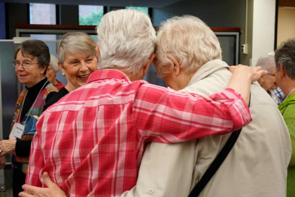 Two women hug at the 2019 agrégée companion gathering