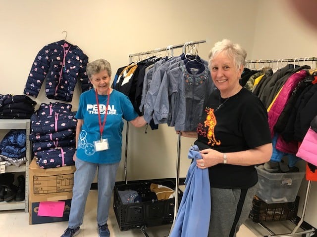 Sisters help in the clothing room at Annunciation House
