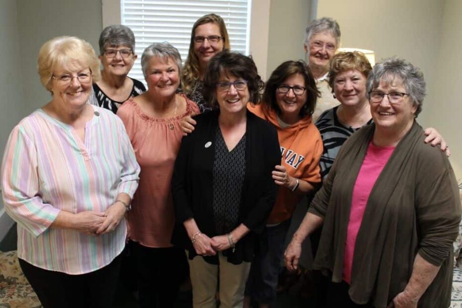 Nine women in a group photo