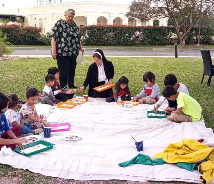 Sister Donna Gibbs working with a group of students