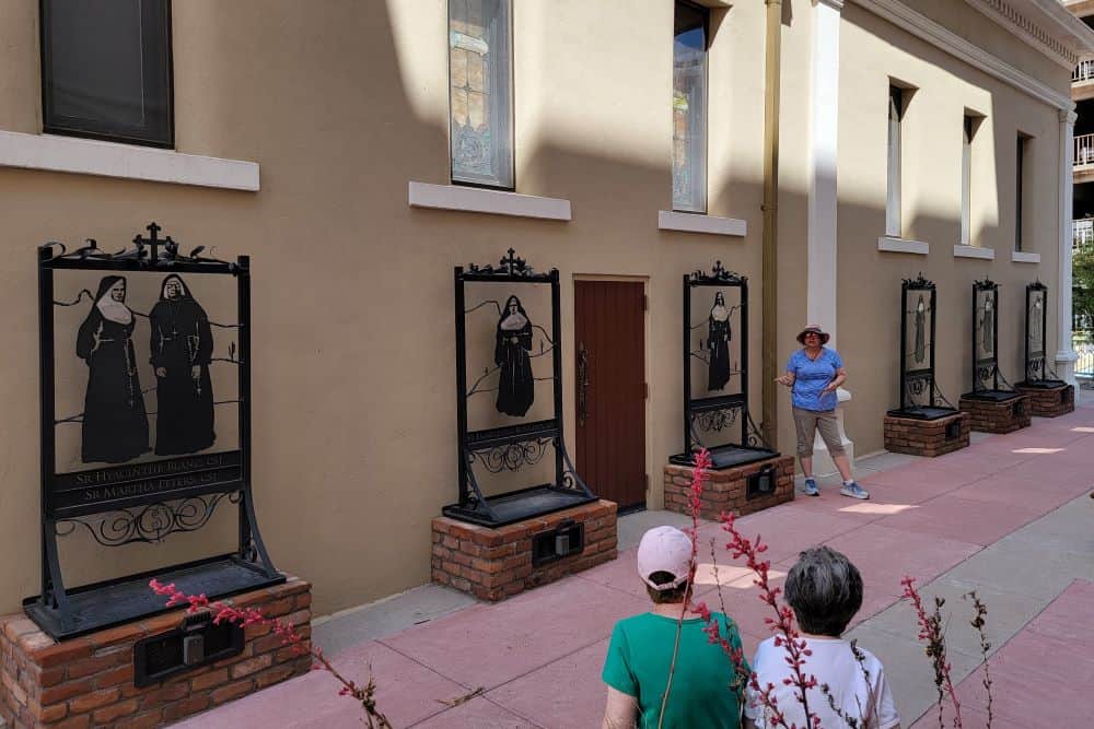 An art installation depicts sisters in habit in the courtyard of the Tucson Cathedral