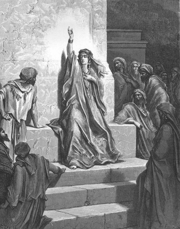 A black and white engraving of a crowd in ancient times gathered on the temple steps around a woman. She wears flowing robes and multiple beaded necklaces and has her arm raised above her head as she gazes serenely at the crowd.