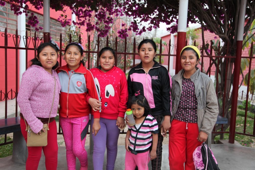 Six students from Fe y Alegría school in Tacna, Peru posing for a group photo.
