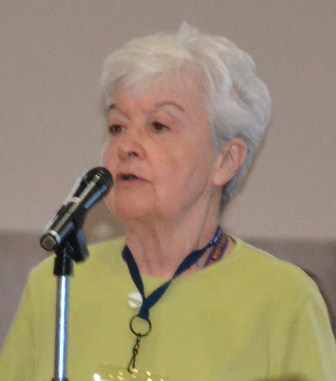 Sister Donna Gunn speaking into a microphone