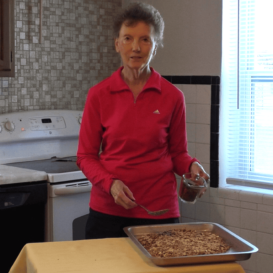 Sister Marion Renkens in her kitchen cooking homemade granola