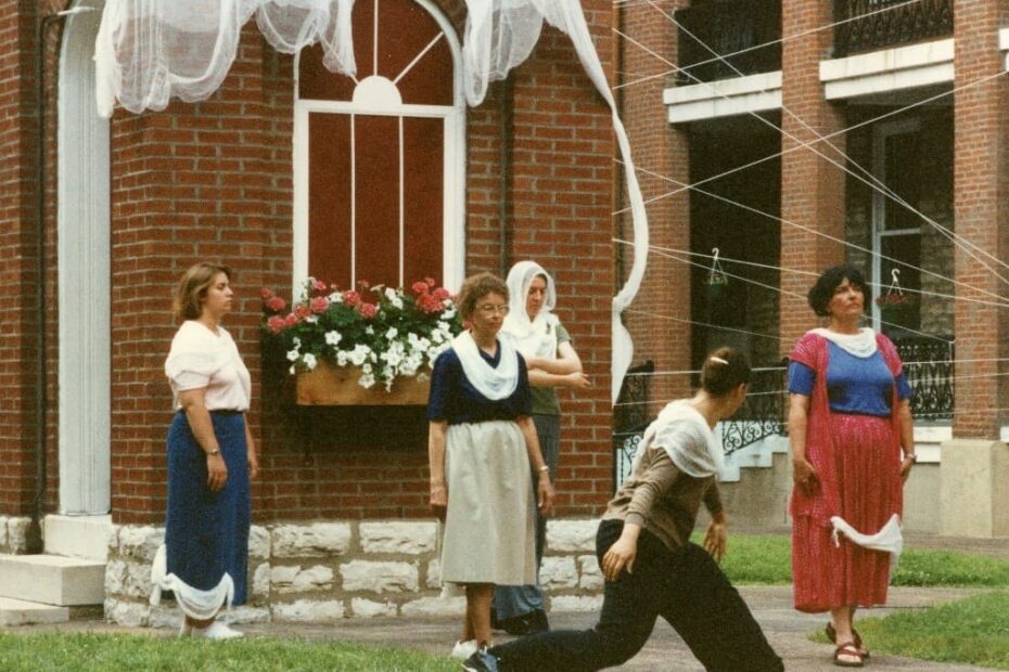 Sisters in the Motherhouse courtyard practicing the dance for an art exhibit