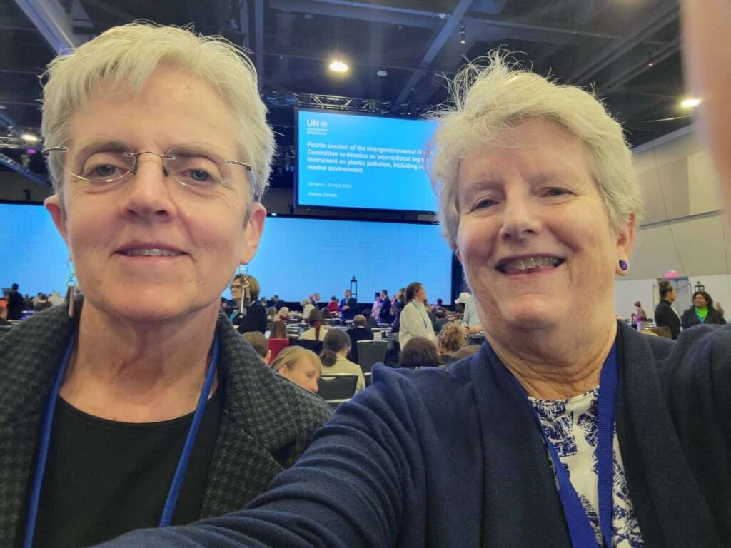 Two women taking a selfie at the INC-4 meeting.