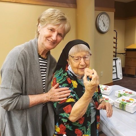 Sisters Joann Heinritz and Rosalind pose for a photo