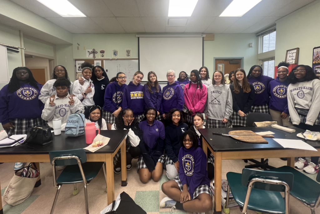 Sister Rita poses with a group of her students