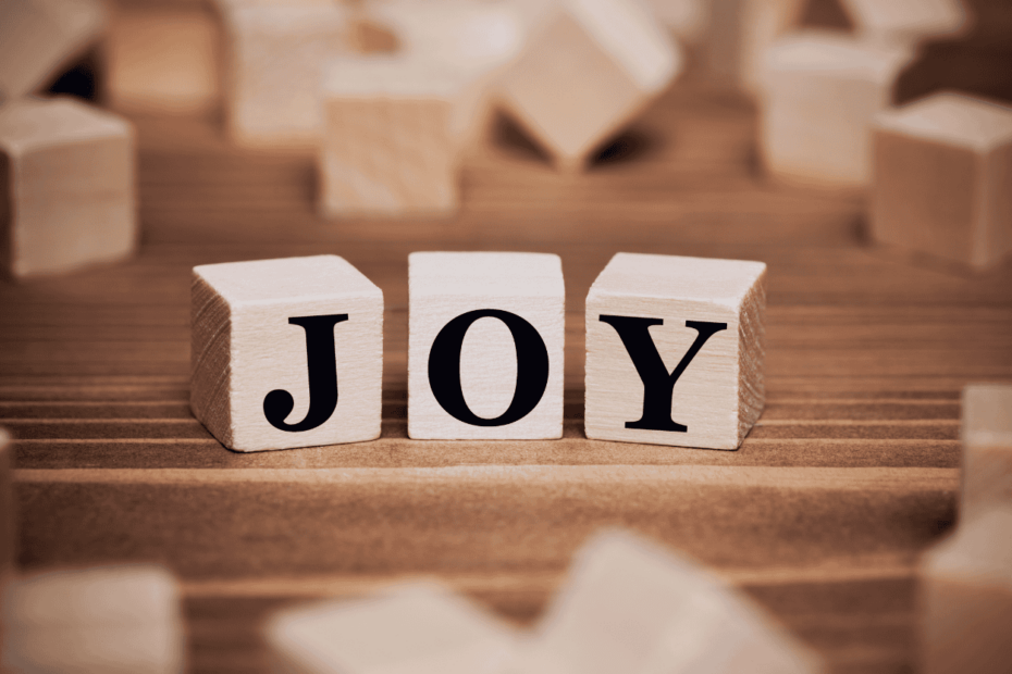 Wooden blocks with "Joy" written across three of them