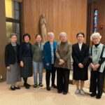 A group of seven sisters--six Japanese and one American--post together in the wood-paneled chapel in Japan