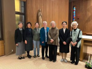 A group of seven sisters--six Japanese and one American--post together in the wood-paneled chapel in Japan