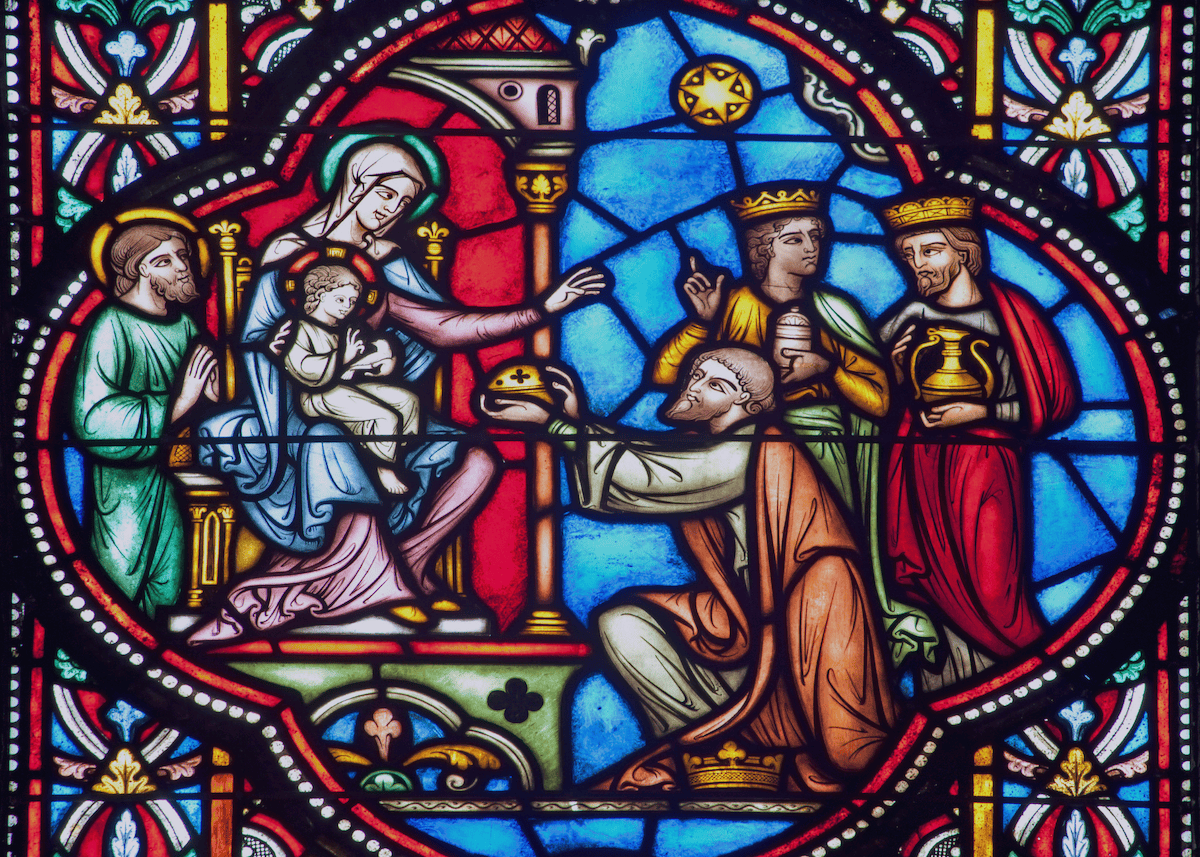 The adoration of the Magi depicted in stained glass in the St. Michael and St. Gudula Cathedral in Brussels, Belgium.