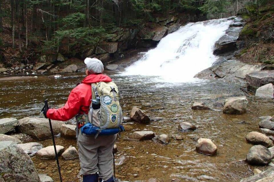 Sister Linda Neil hiking by a stream