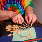 Close up of Sister Nancy Marsh's hands lacemaking