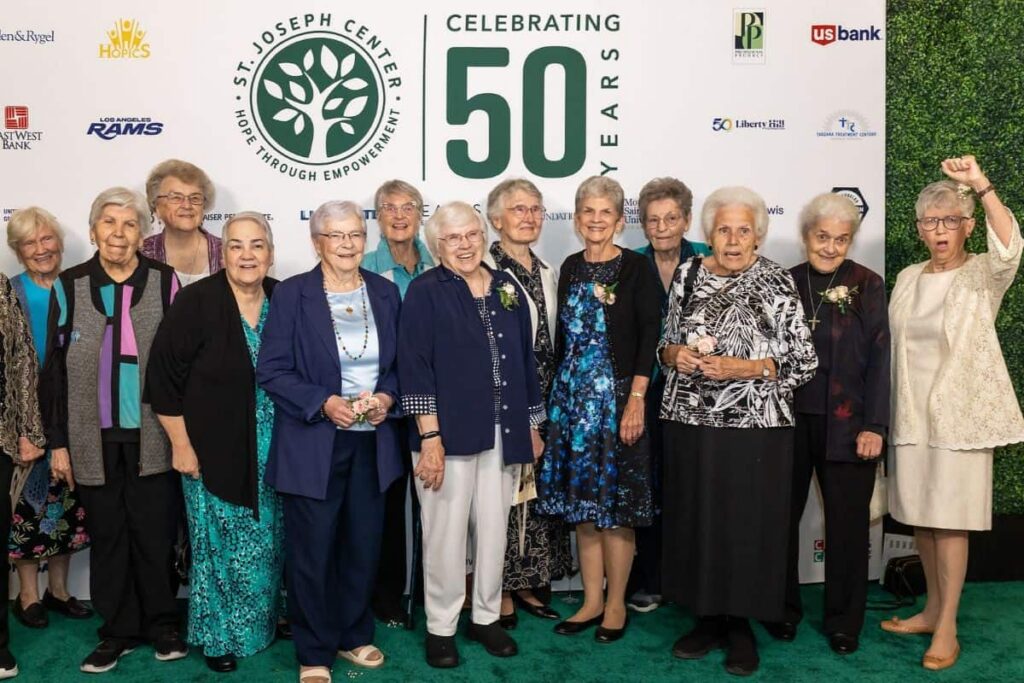 A large group of sisters taking a photo at the St. Joseph Center 50th Anniversary Gala