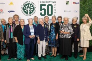 A large group of sisters taking a photo at the St. Joseph Center 50th Anniversary Gala