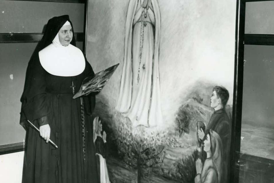 A black and white photo of Sister Evelyn Marie Reznick, CSJ next to her painting, "Our Lady of Fatima"